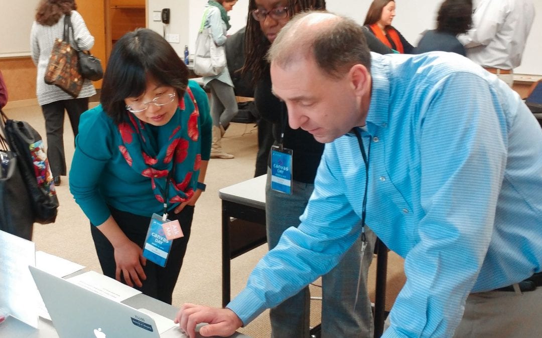 attendees interact with presenters at Canvas Day